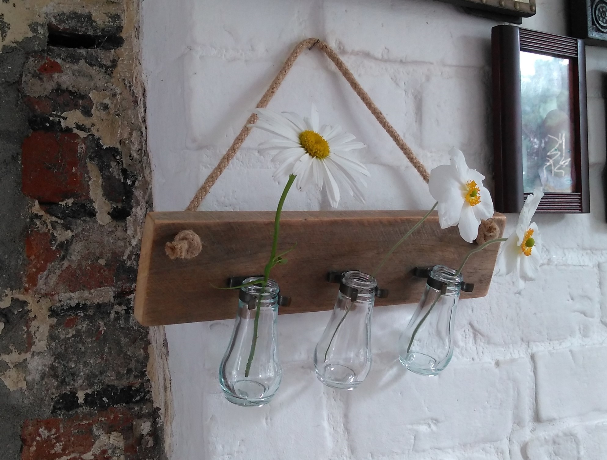 Recycled bottles, jubilee clips and pallet wood wall hung vases